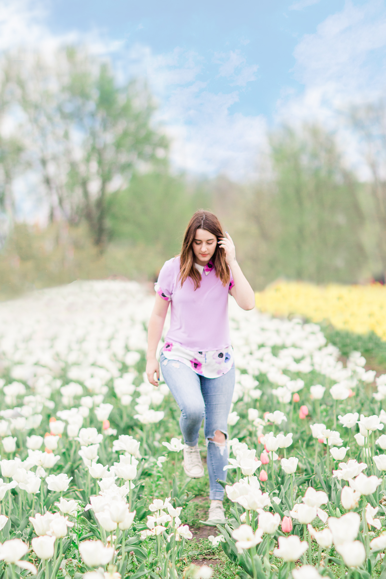 Girl walking through tulip field, Holland Michigan | Hayley Moore Photography | Fort Wayne, Indiana Photographer | www.hayleymoore.com