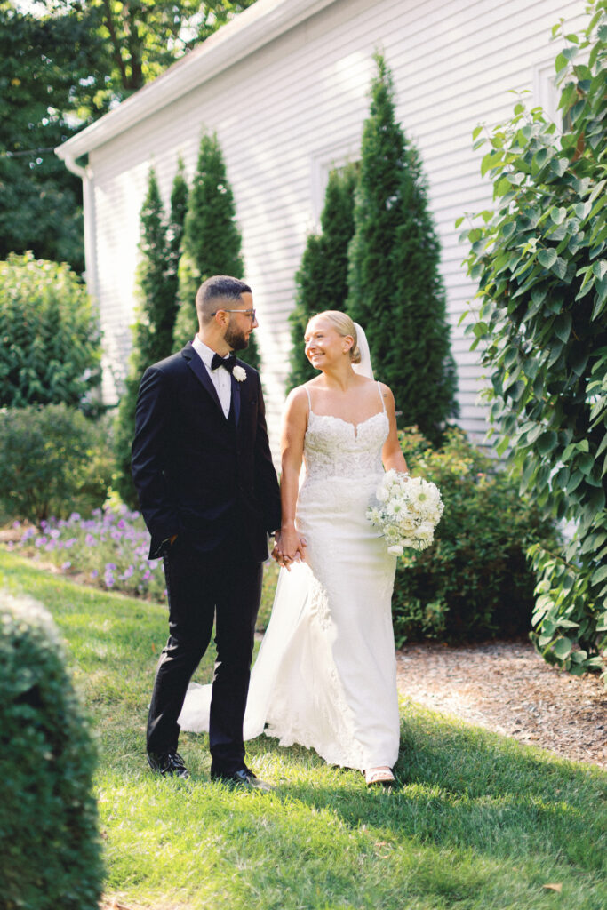 couple walking hand and hand in garden