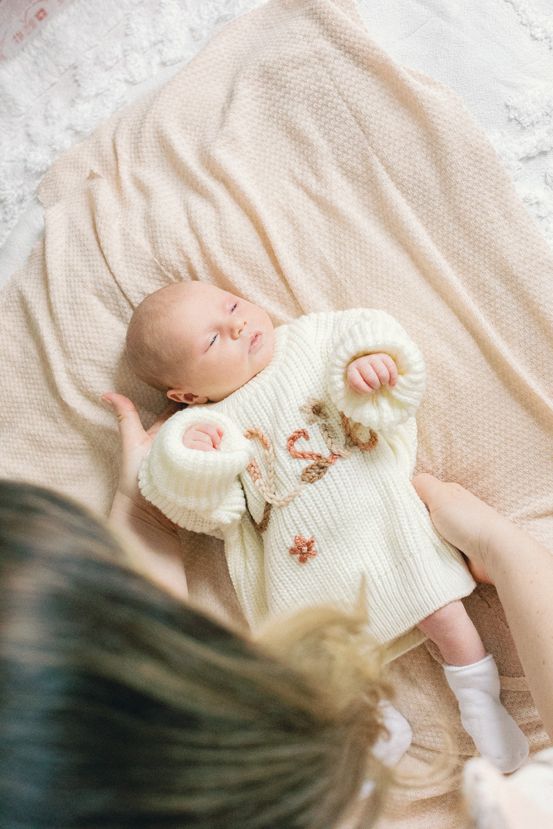 mom playing with newborn 