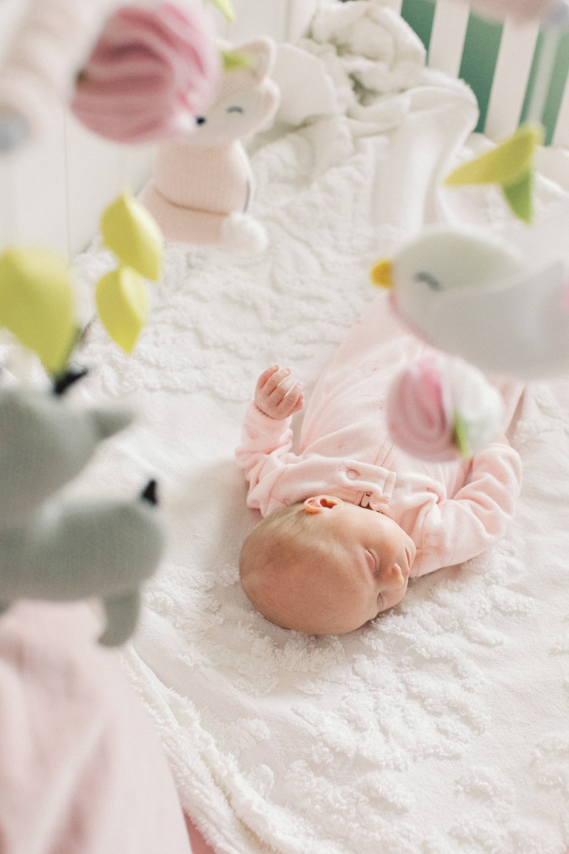 newborn baby sleeping in crib