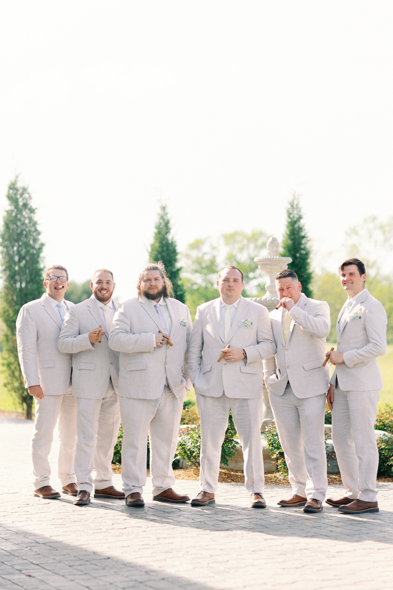groomsmen smoking a cigar