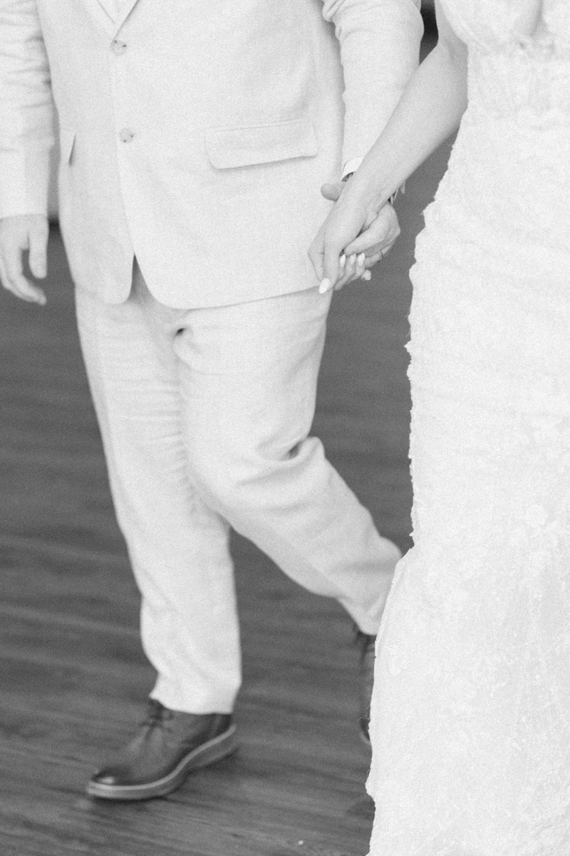bride and groom holding hands
