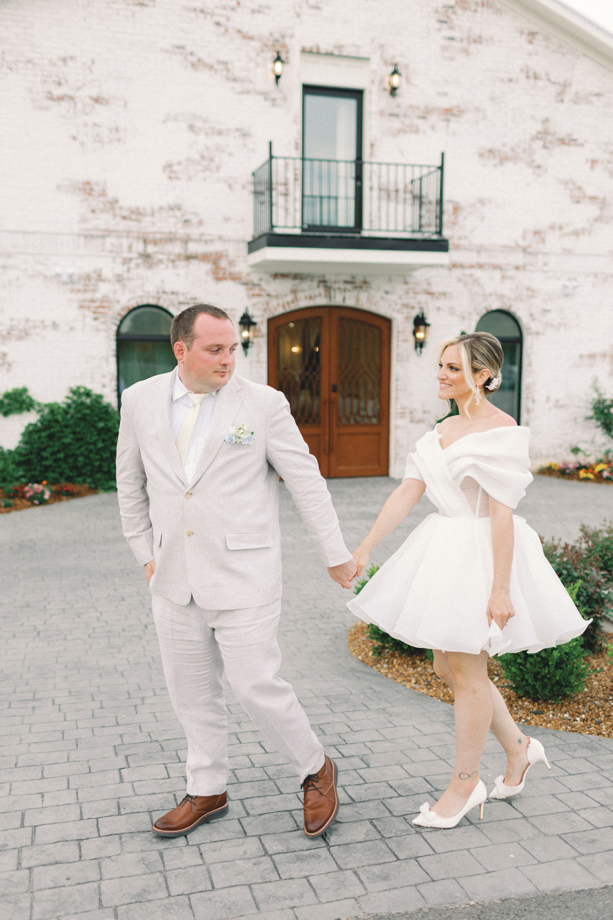 couple walking in front of venue
