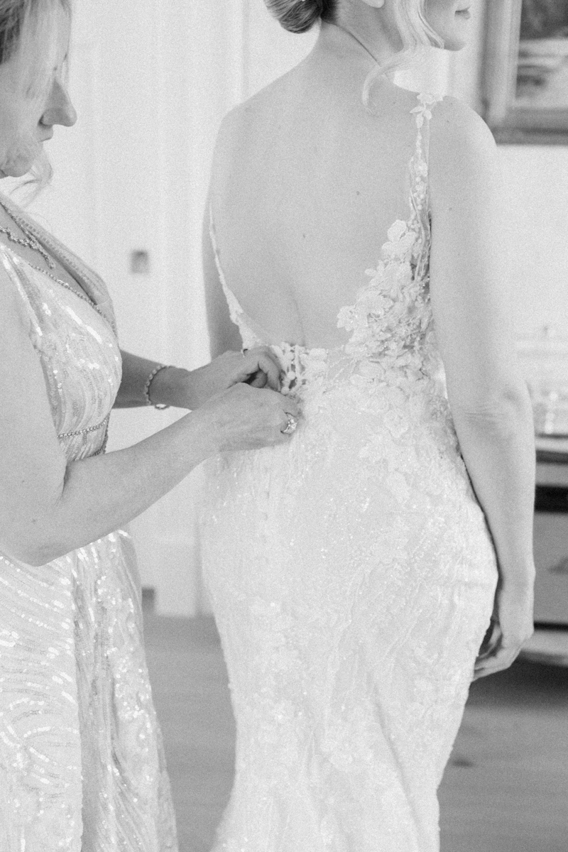 bride putting on dress