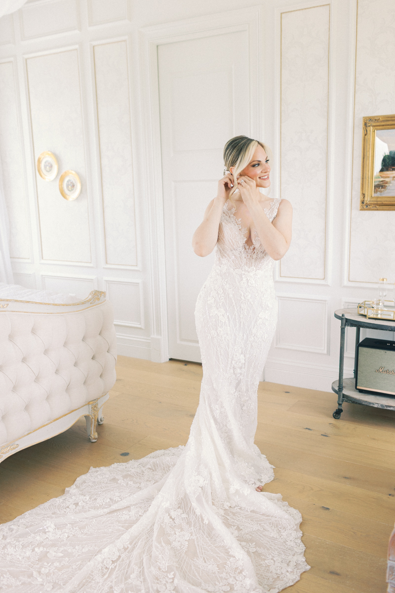 bridal putting on earrings