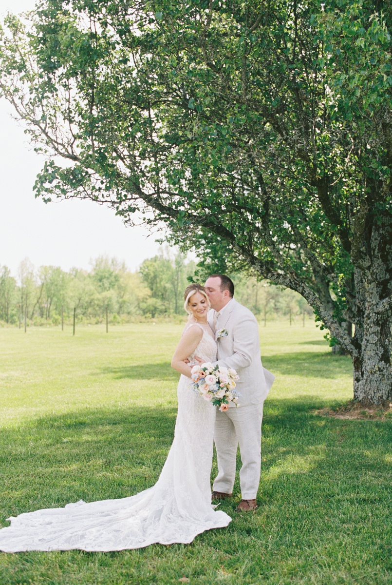 groom and bride kissing