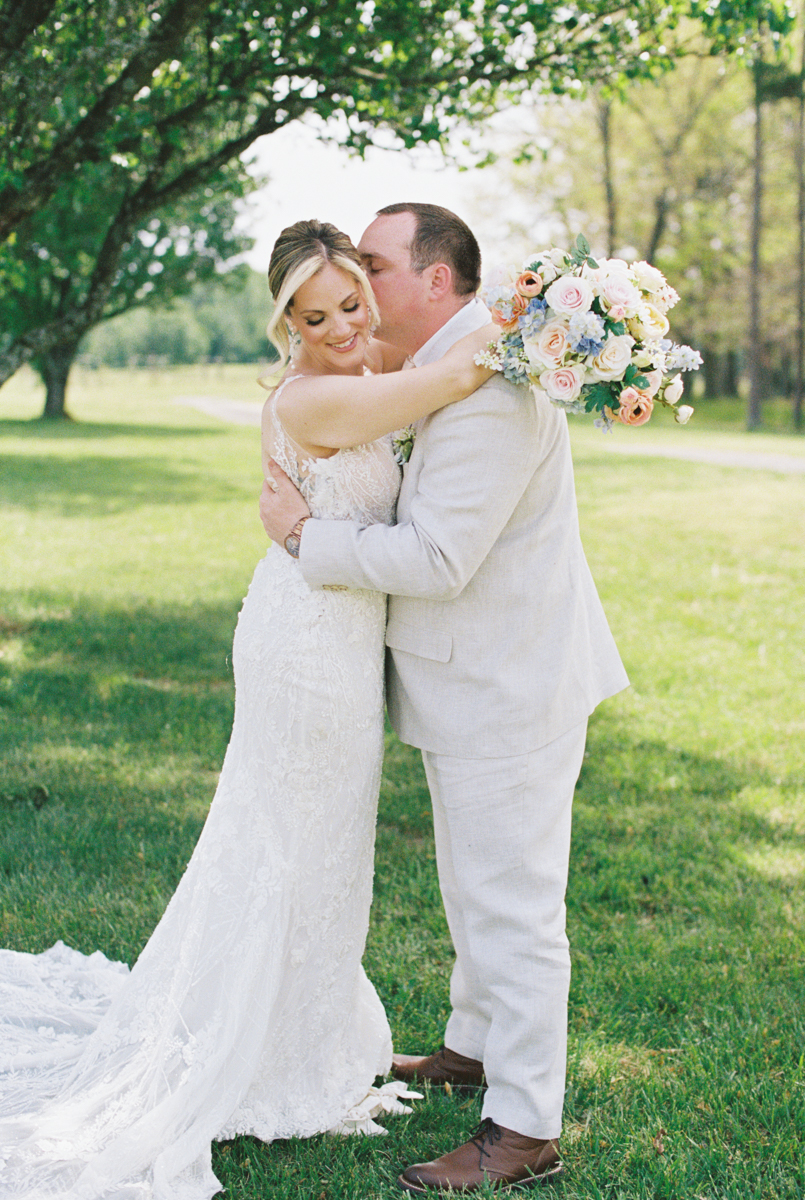 groom and bride kissing