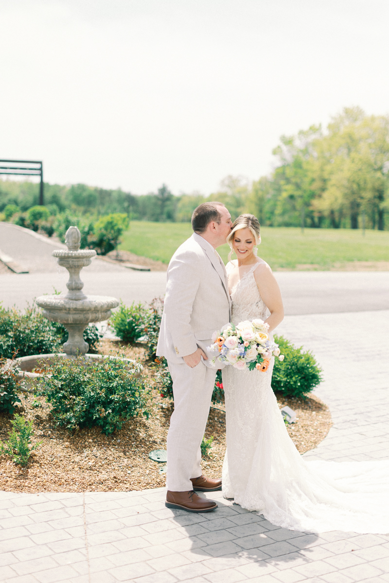 groom and bride kissing