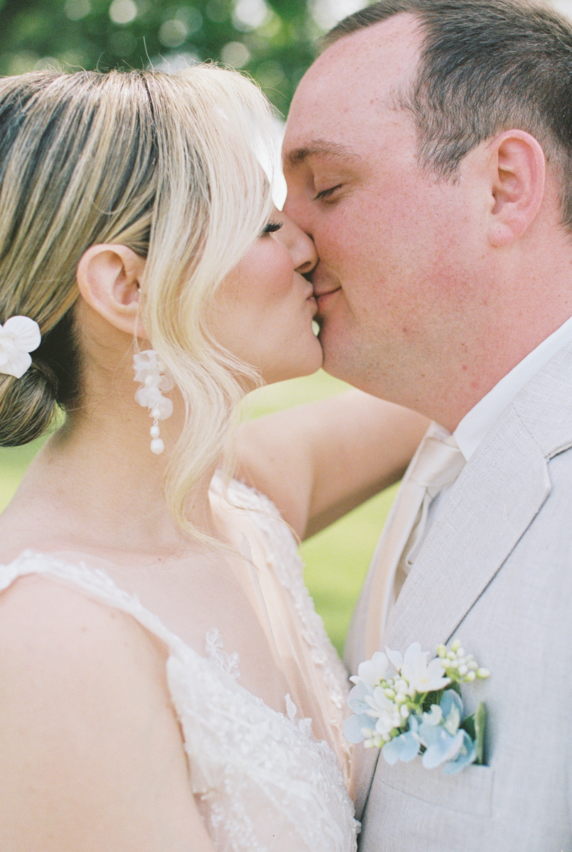groom and bride kissing