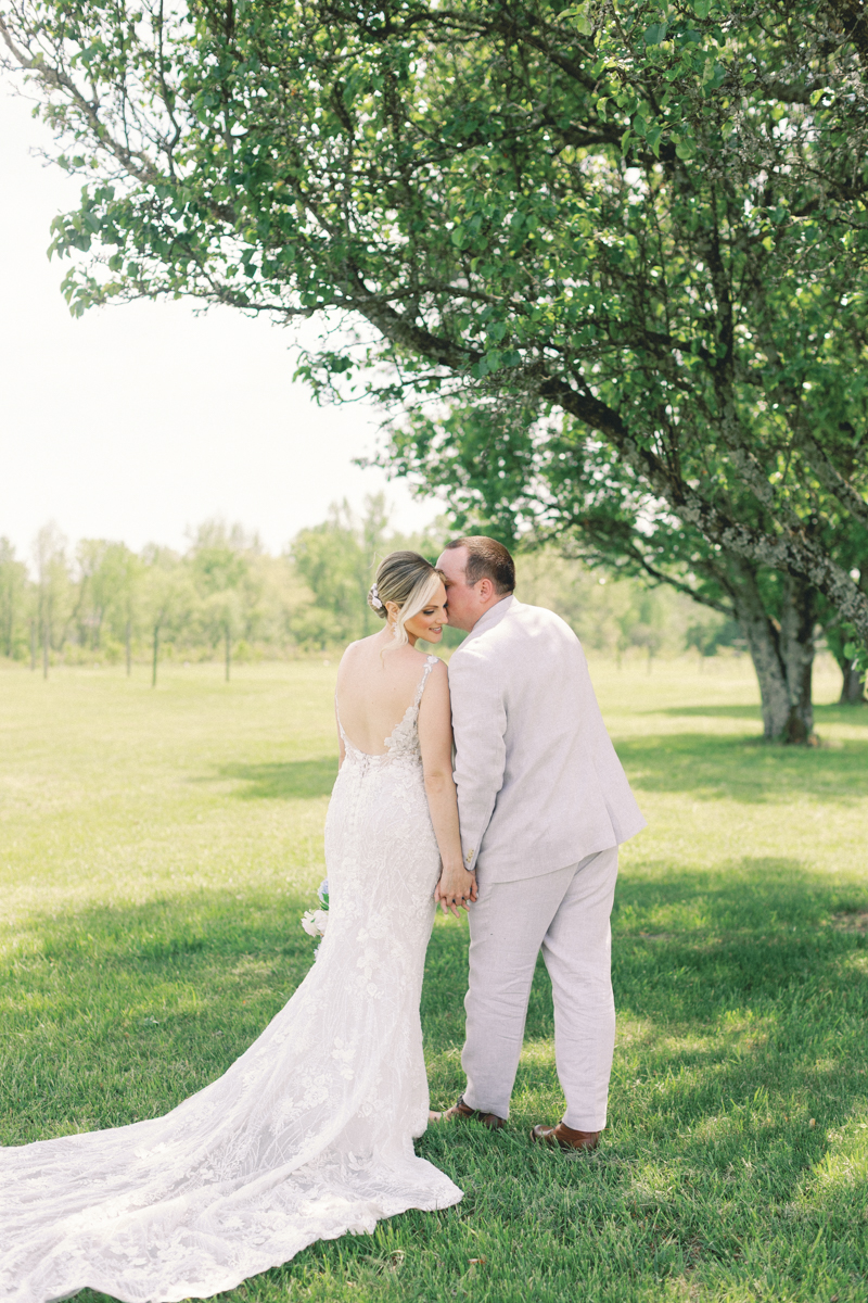 groom and bride kissing