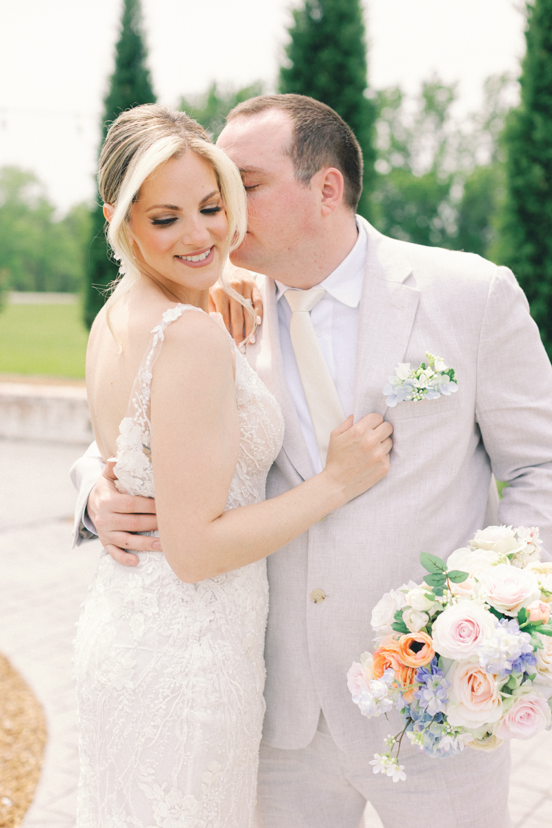 groom and bride kissing