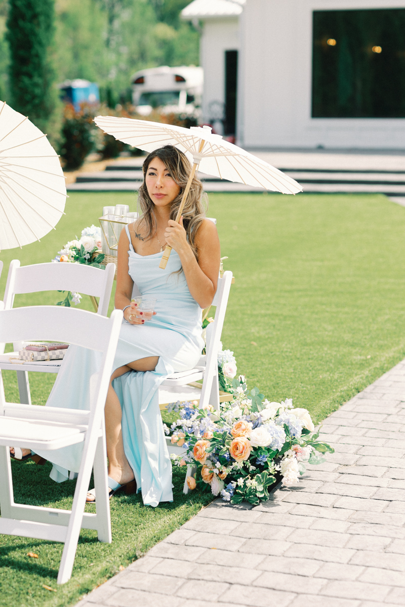 guest waiting for ceremony with parasol