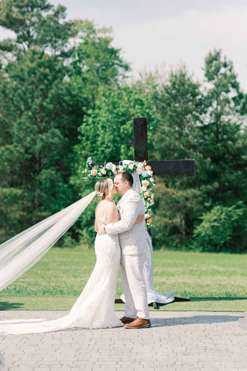bride and groom ceremony kiss