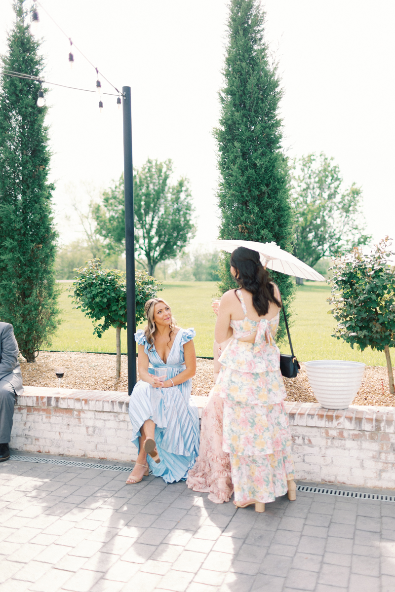 bridesmaids talking at cocktail hour