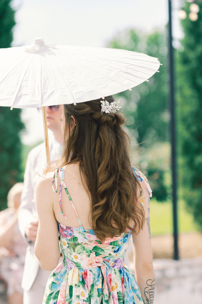 bridesmaid holding a parasol