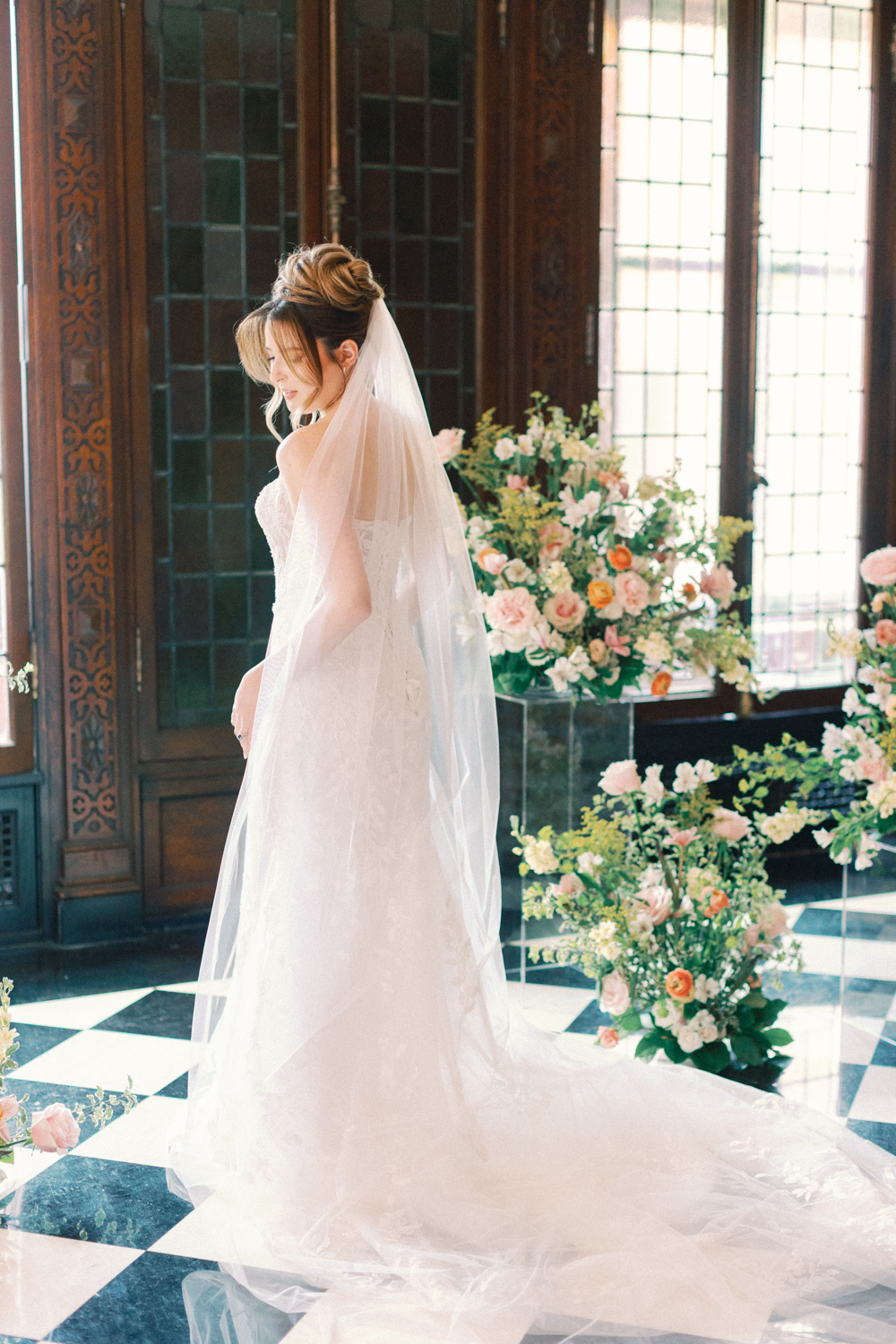 bride in front of flowers