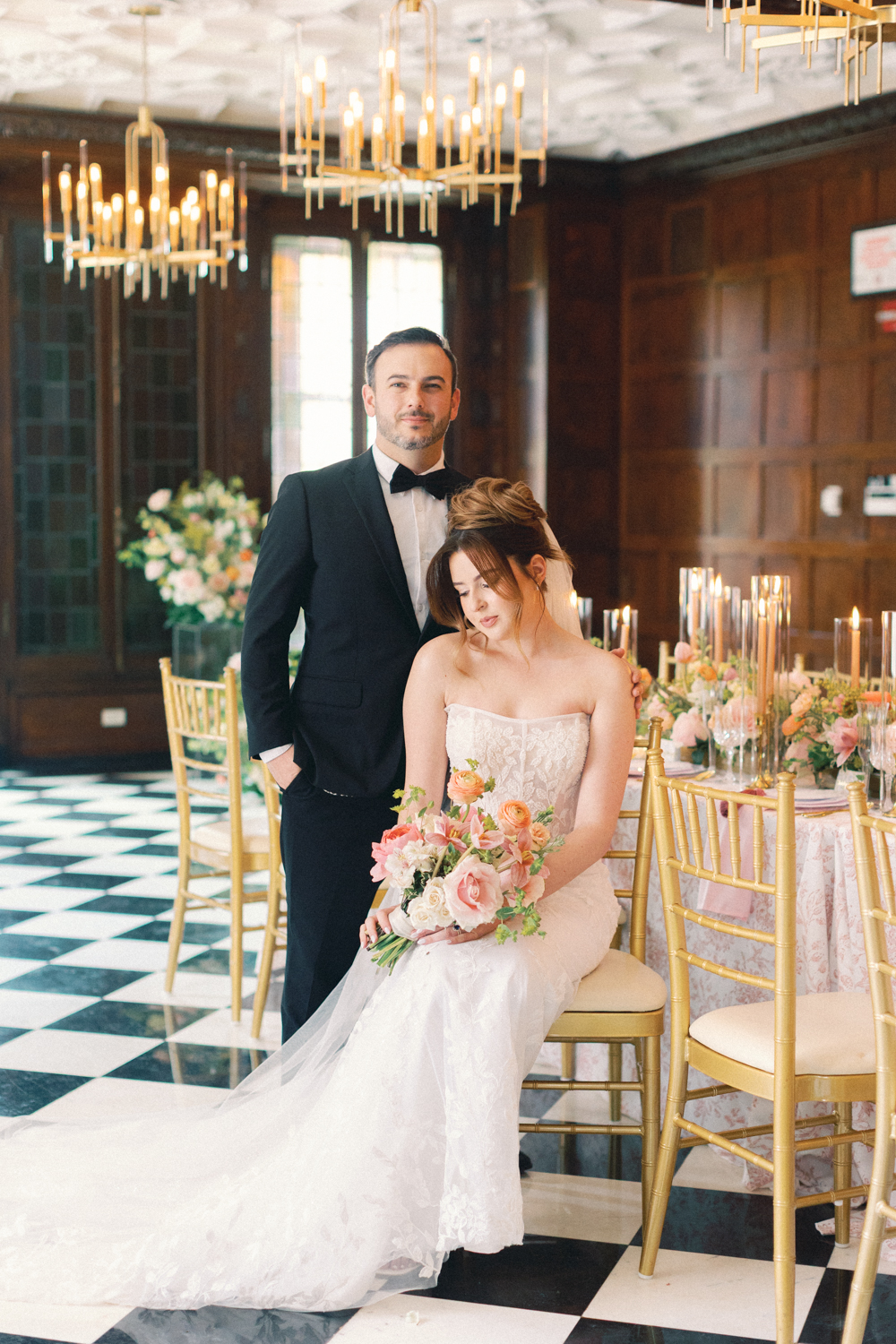 bride and groom sitting at reception table