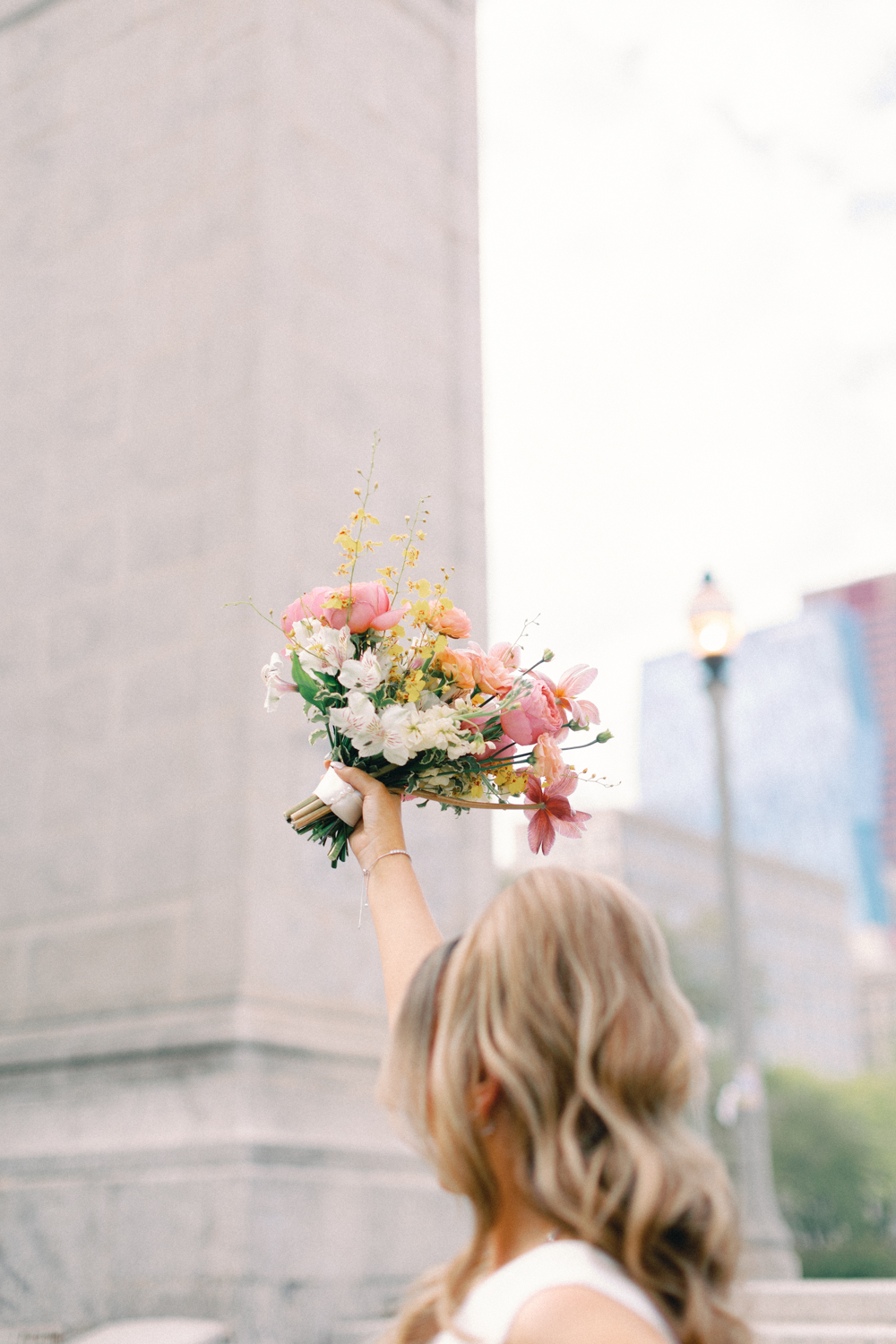 bride holding flowers