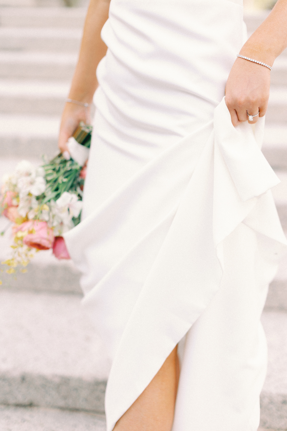 bride holding her dress