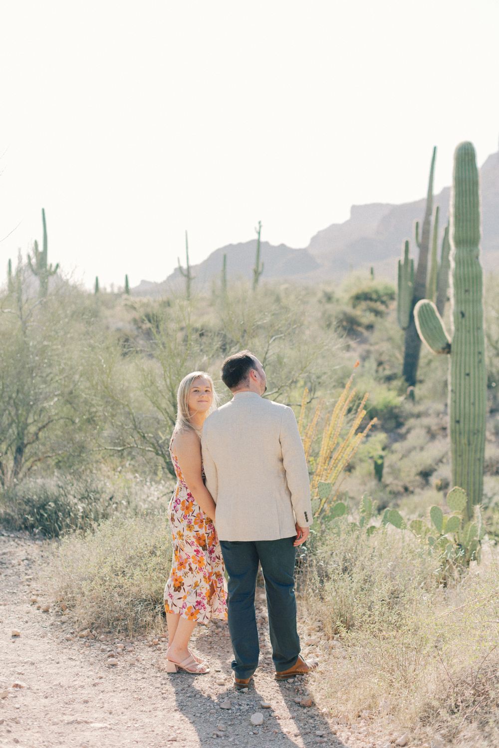 couple gazing at cacti