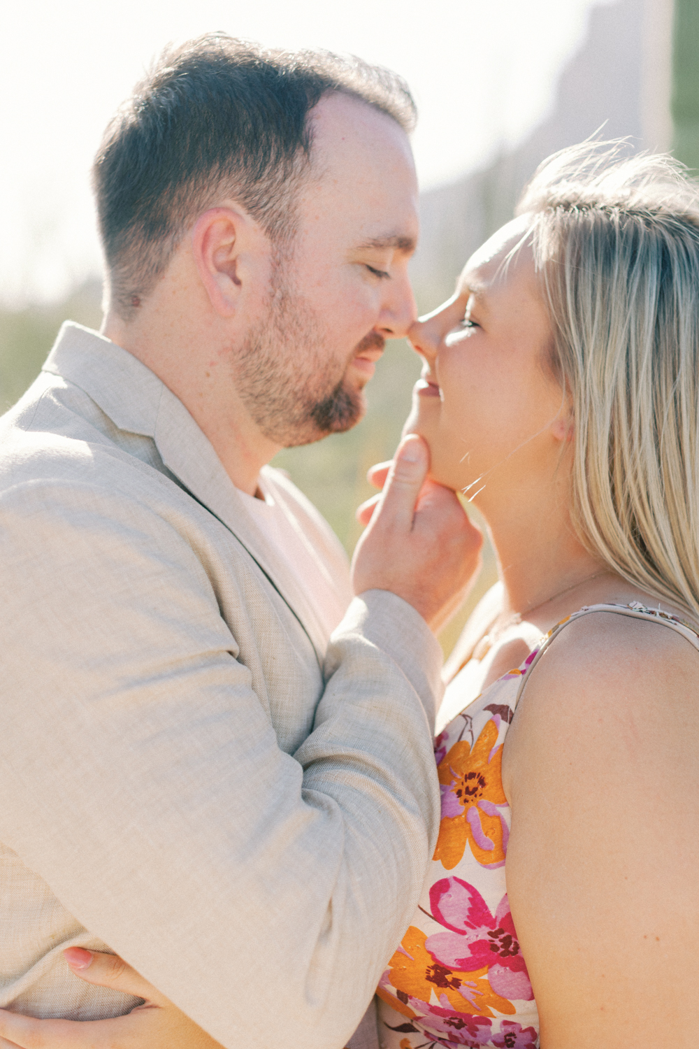 groom holding brides chin