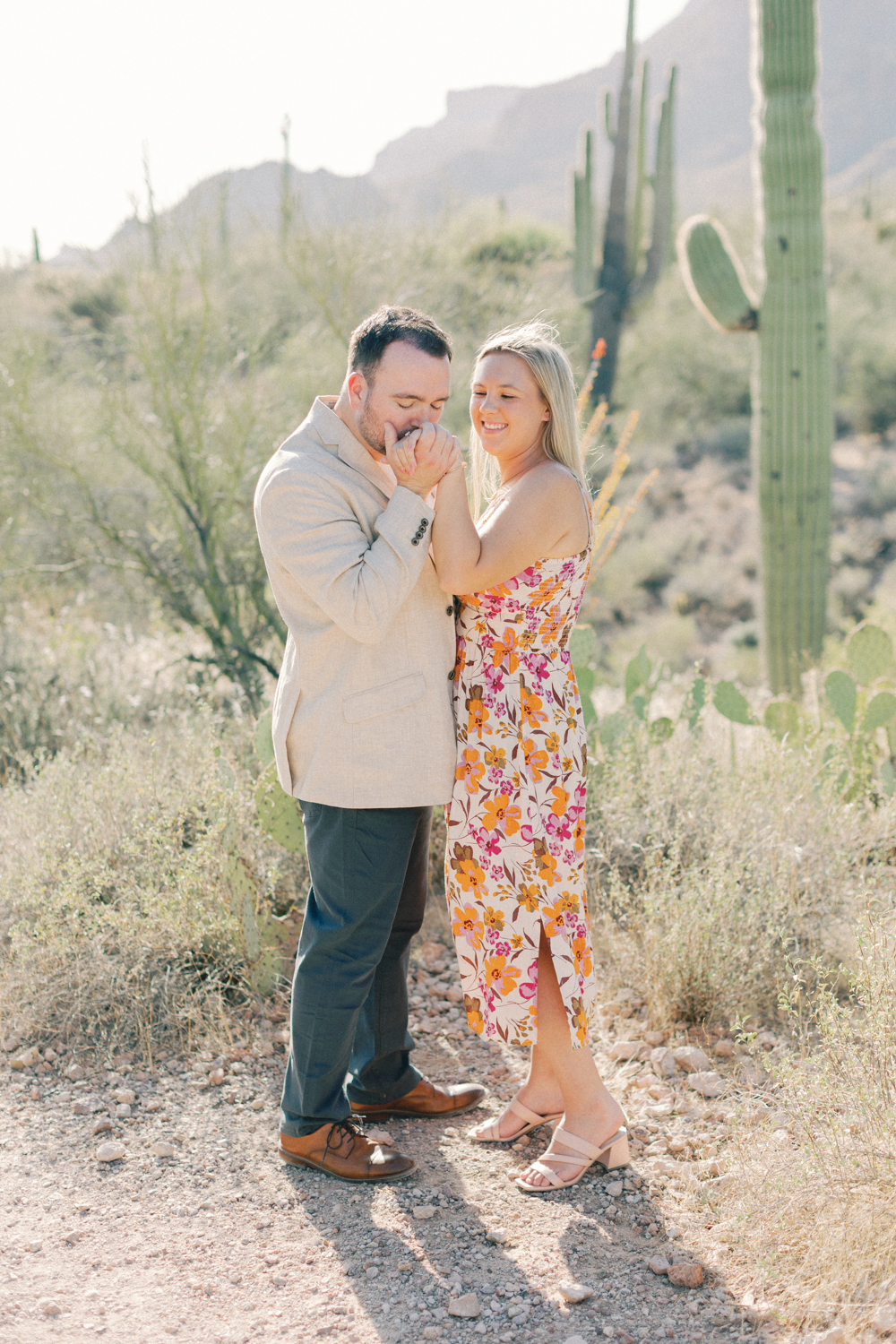groom kissing brides hand
