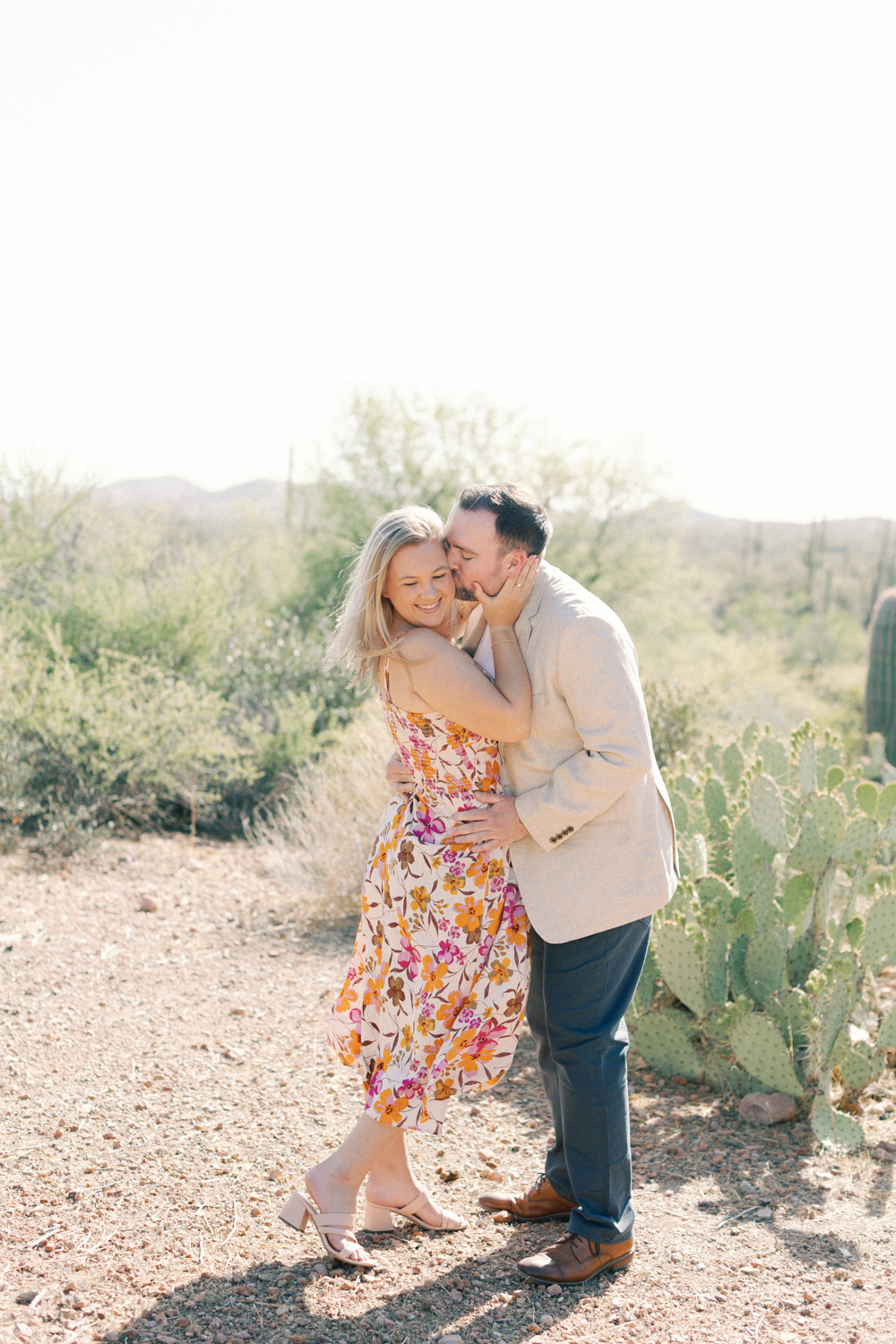 couple kissing and laughing