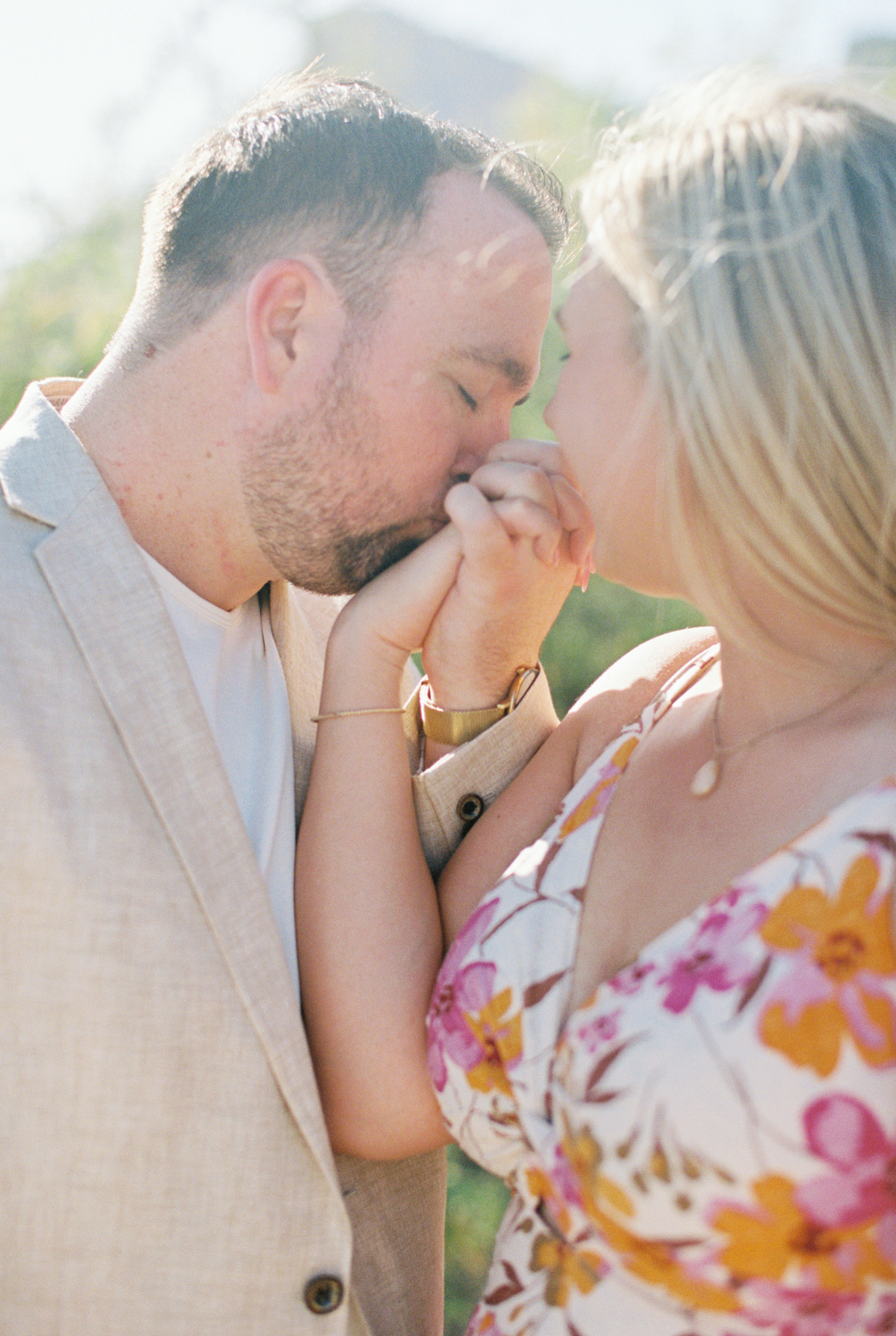 groom kissing brides hand