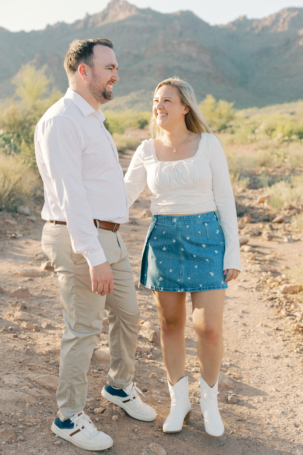 couple walking in desert candidly