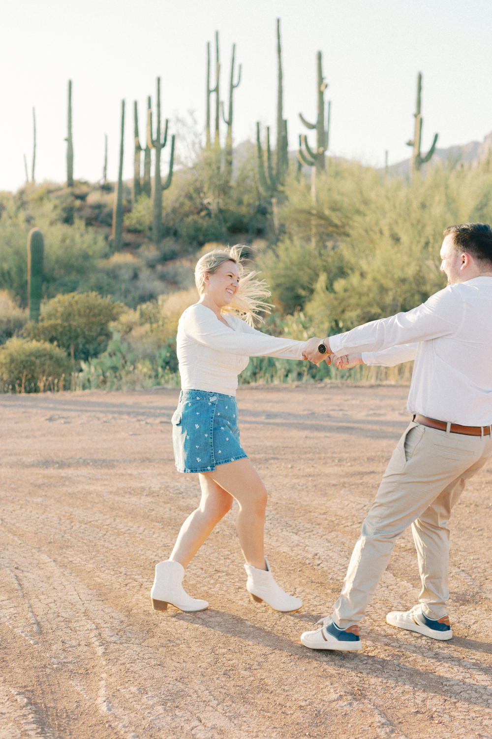 couple spinning in desert