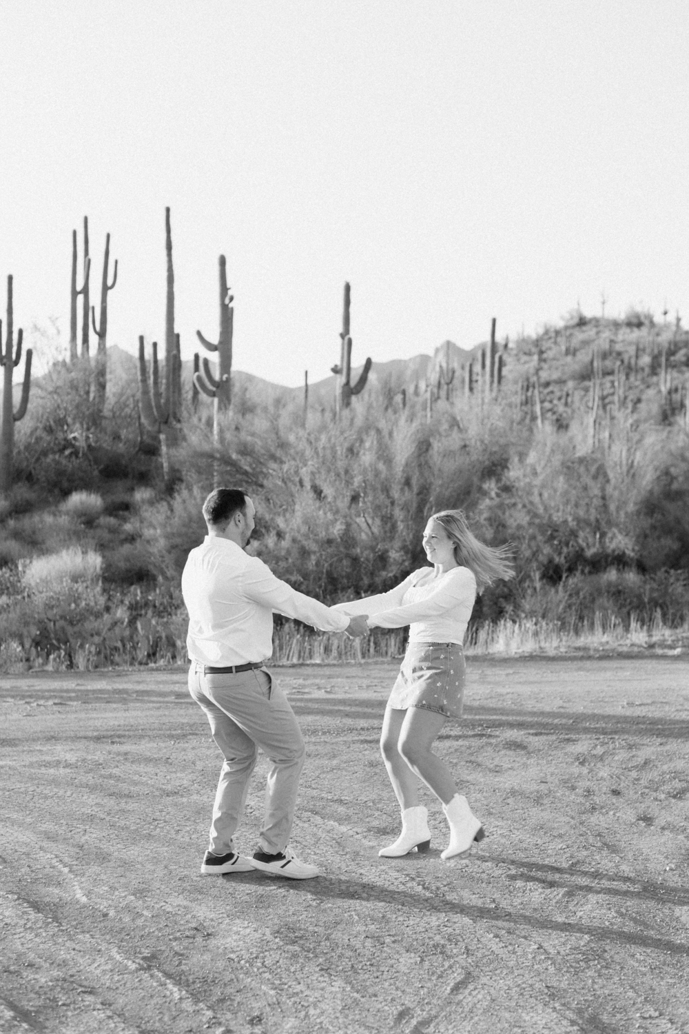 couple spinning in desert