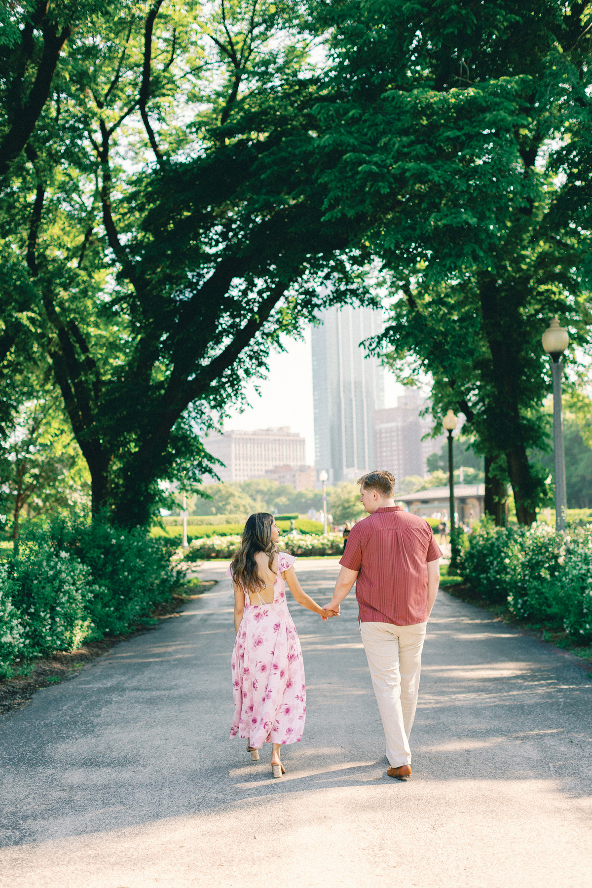 couple walking in tunnel tree