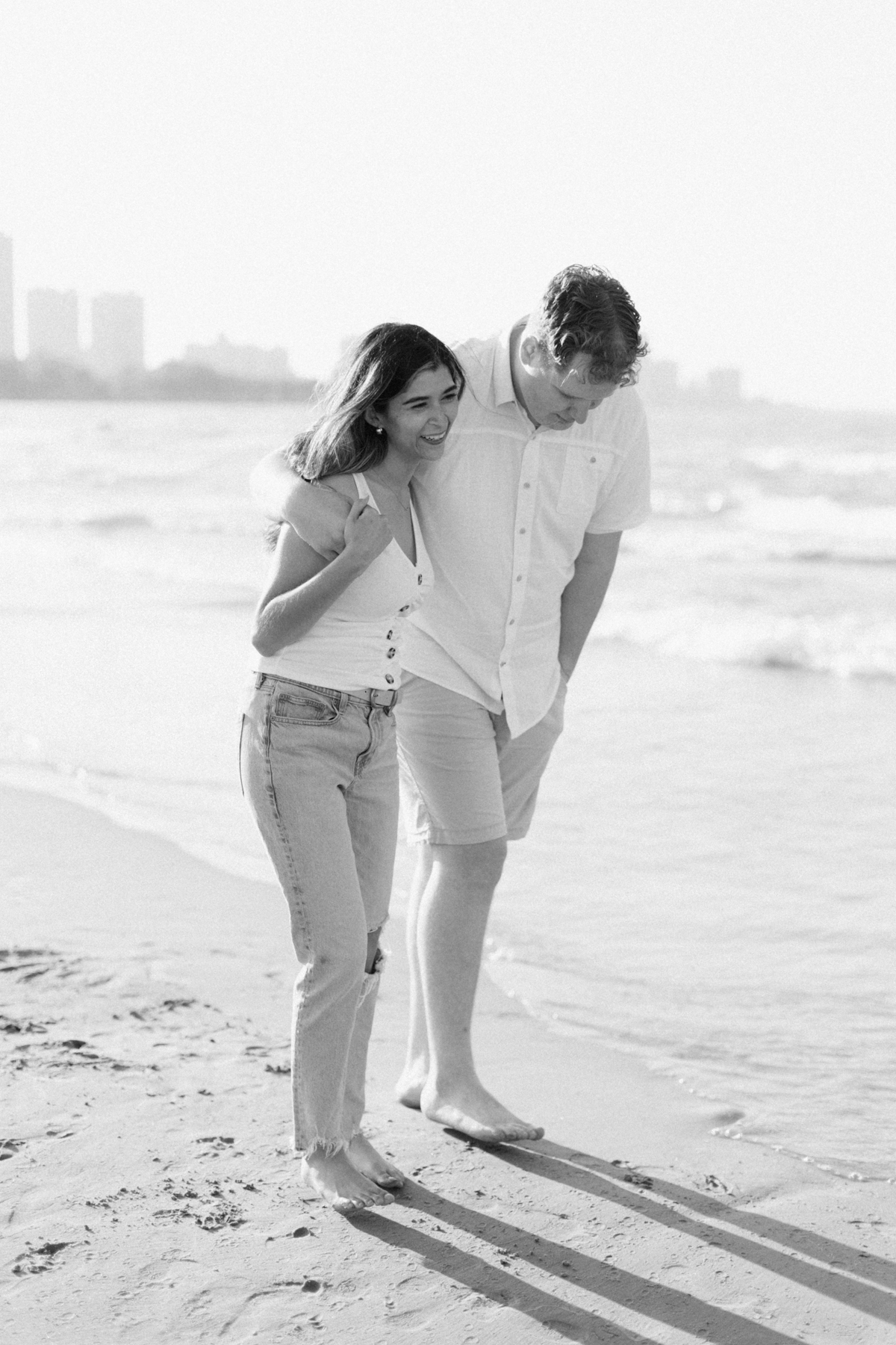 couple walking on beach coast
