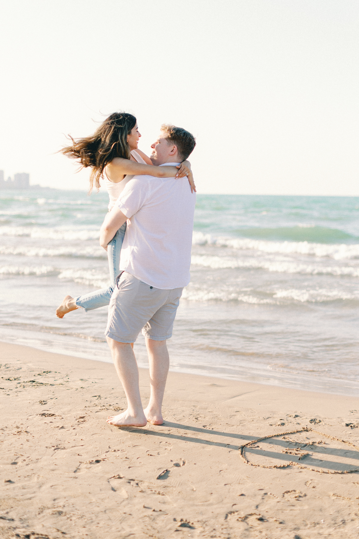 couple spinning at beach