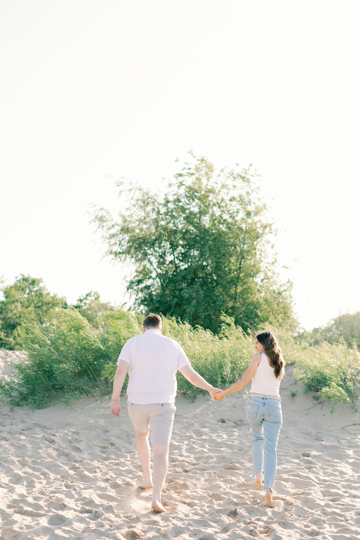 couple running in sand
