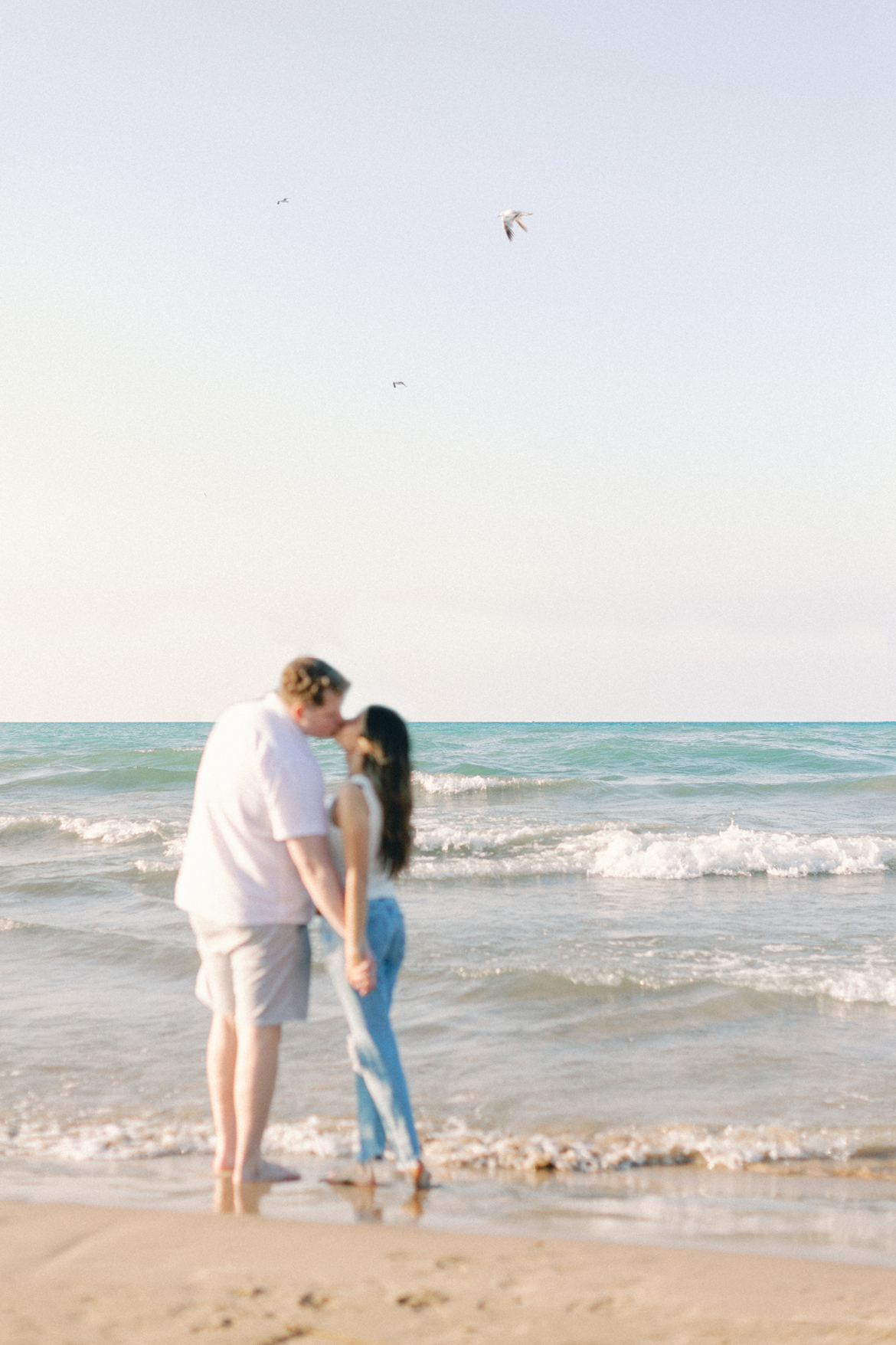 couple in front of water