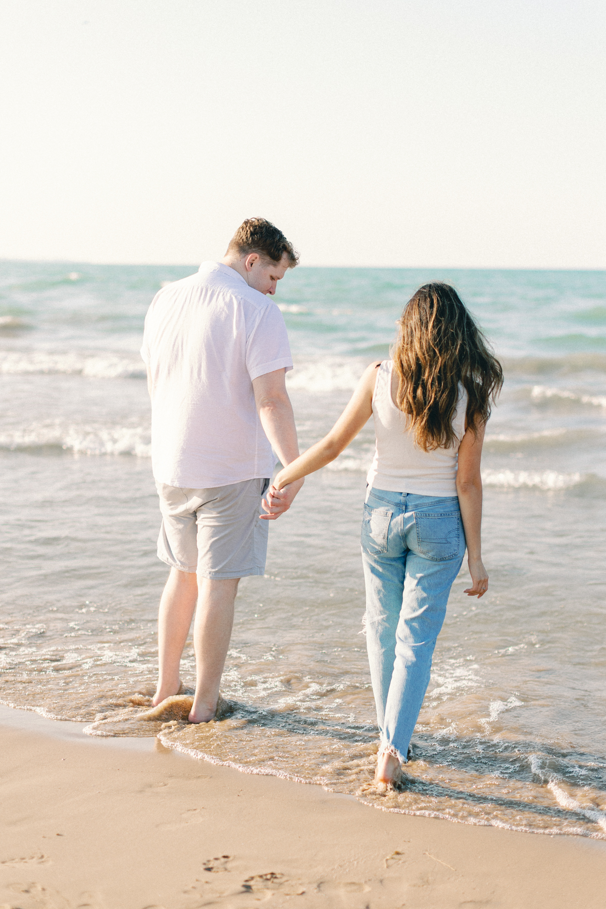 couple at the shore walking