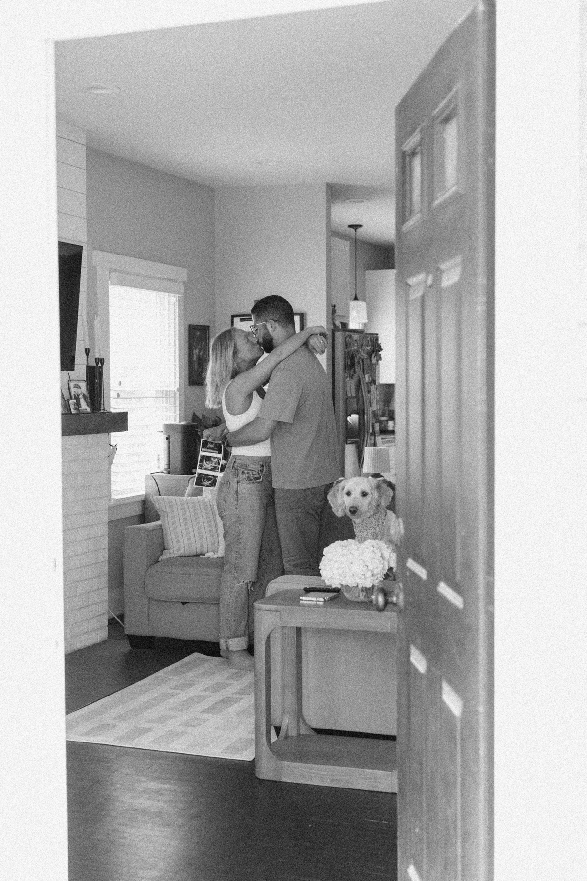 couple in living room with dog