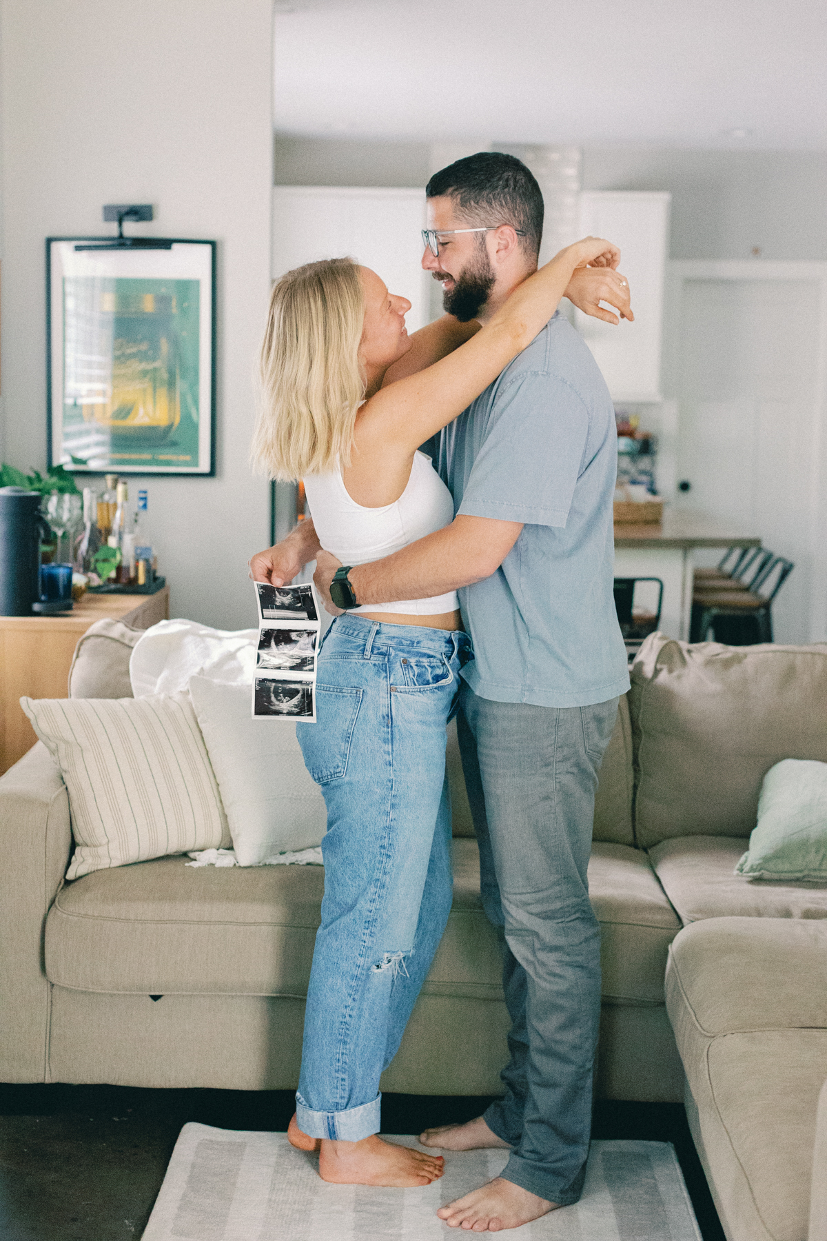 couple holding each other with ultrasound picture