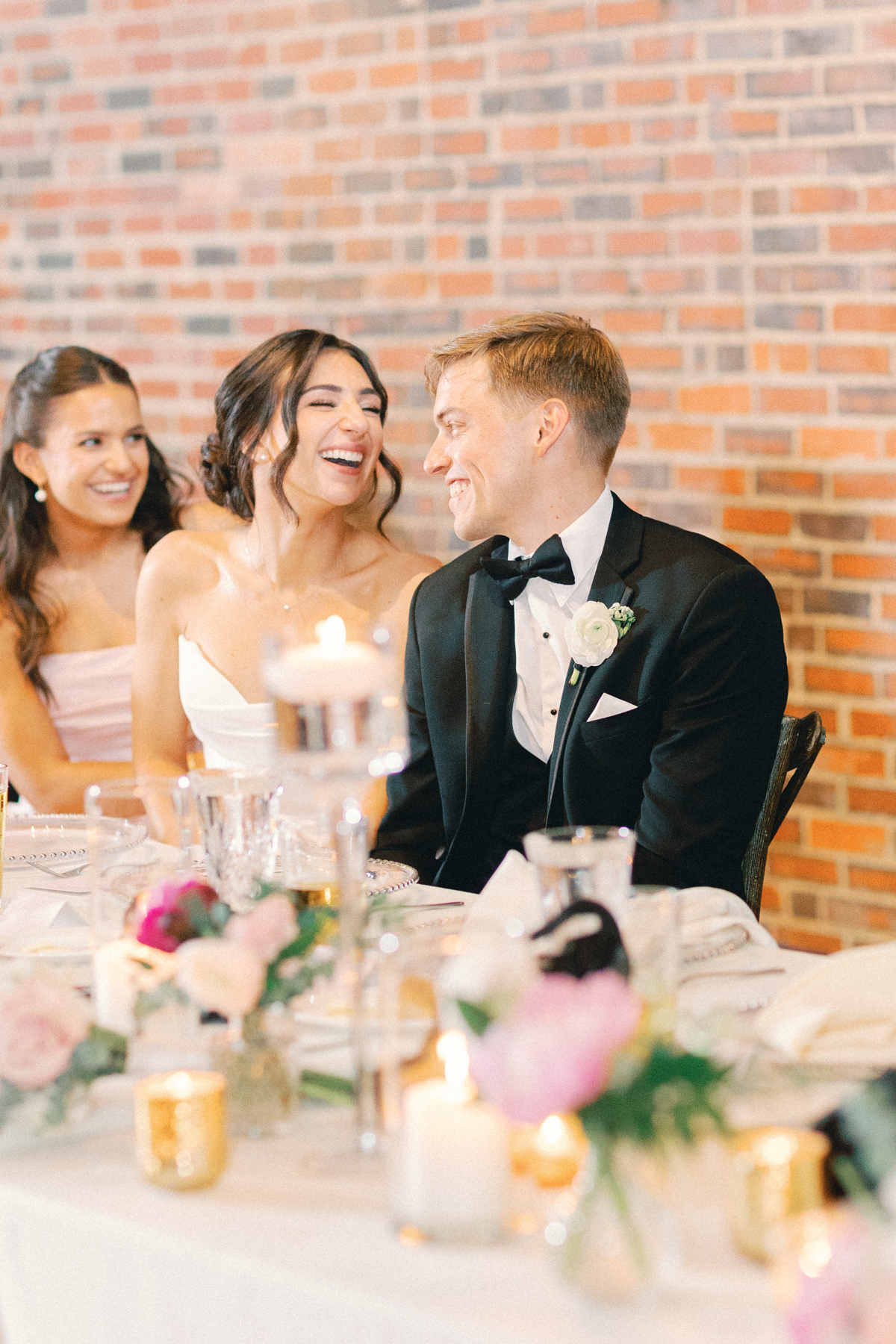 bride and groom laughing