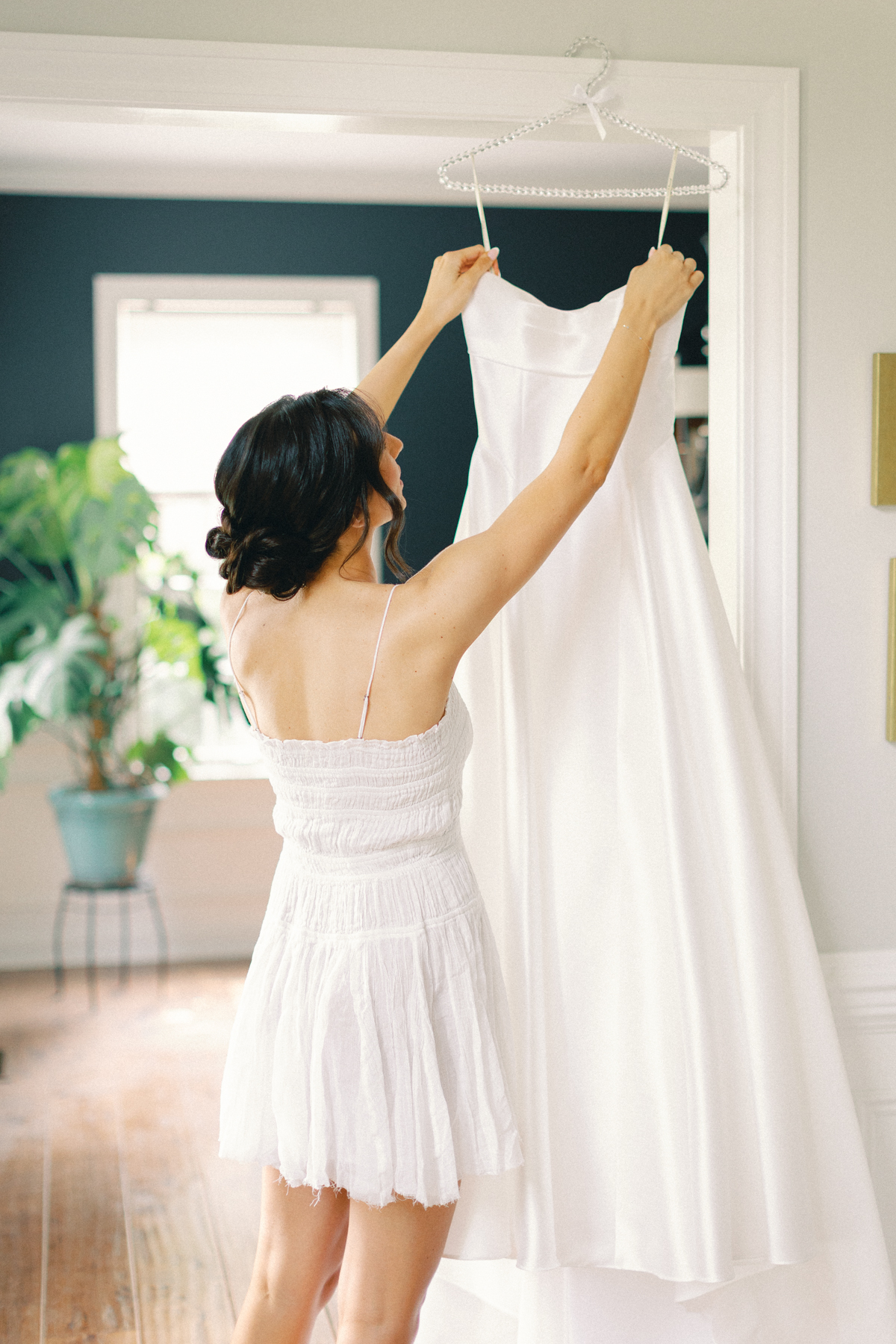 bride putting on dress