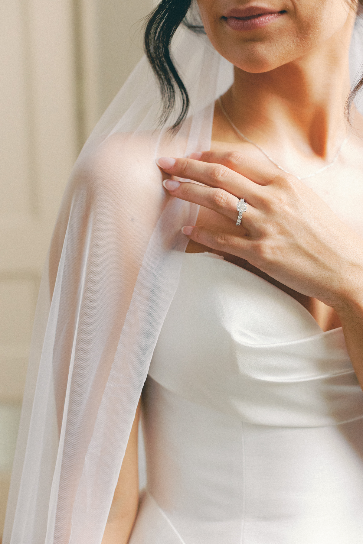 bride with veil and ring
