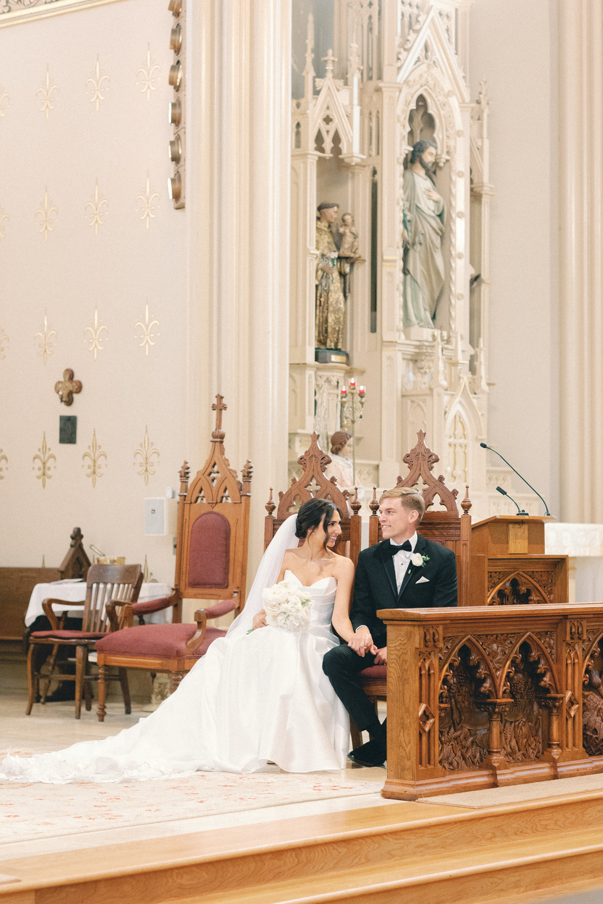 bride and groom sitting at ceremony