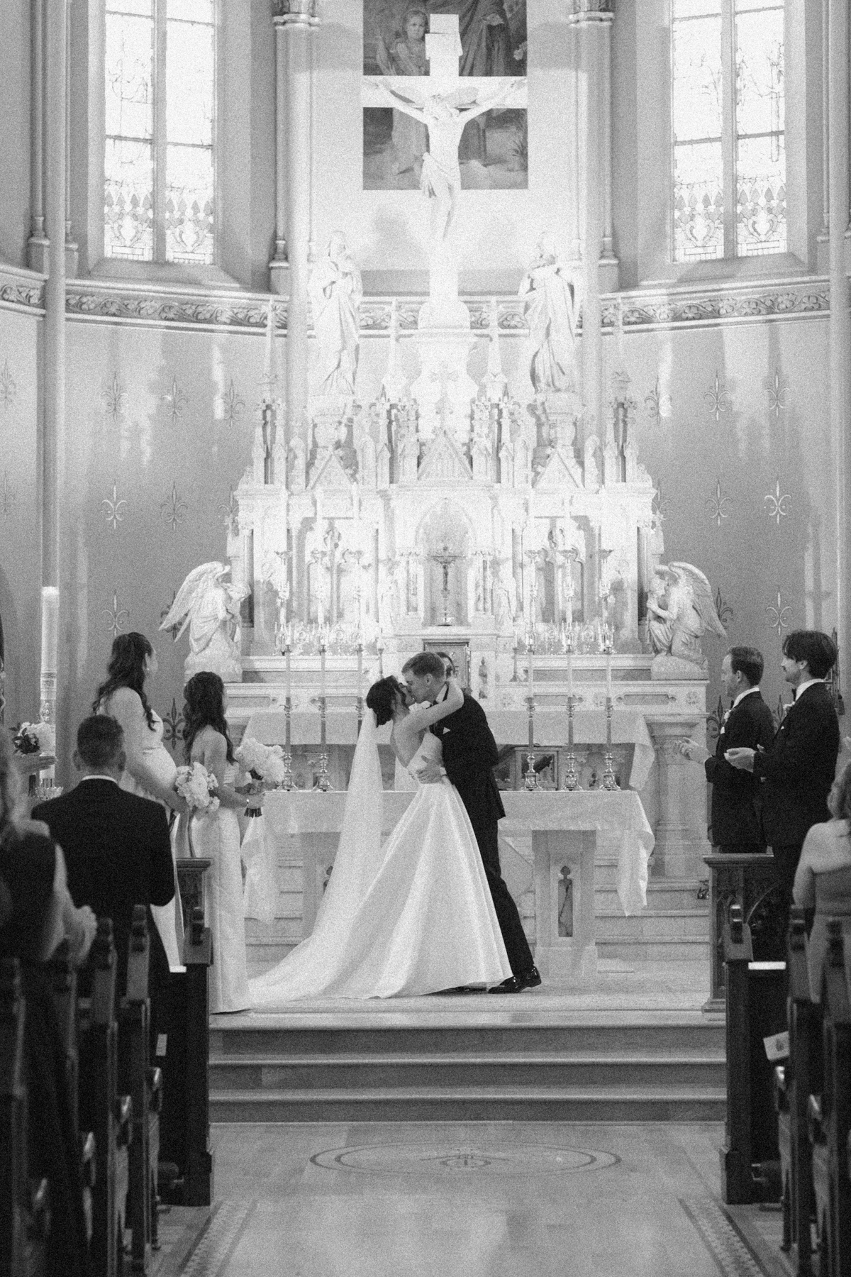 bride and groom first kiss