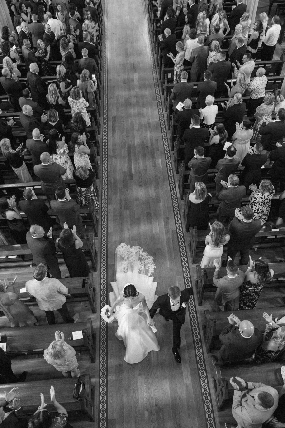 bride and groom walk down aisle