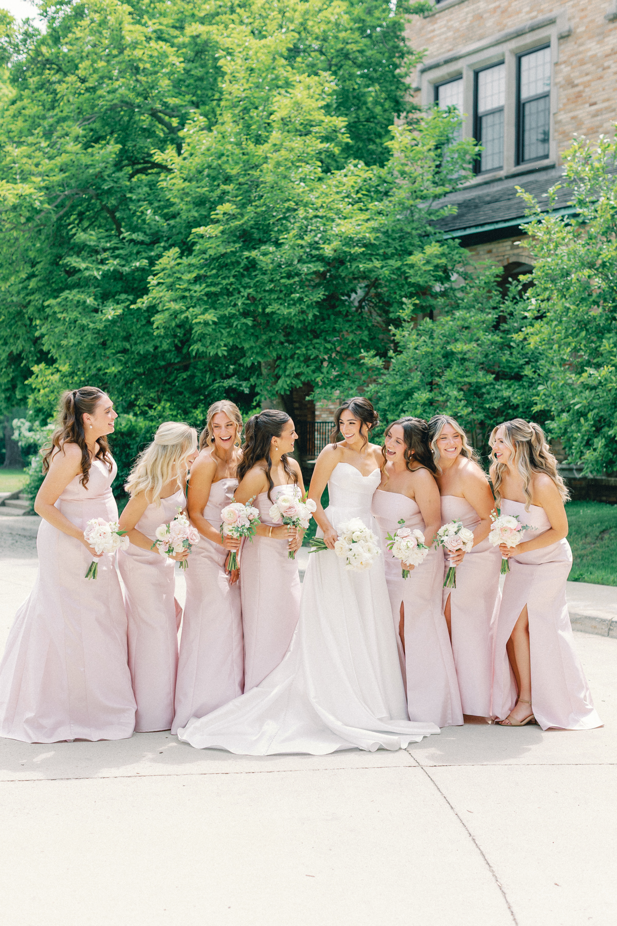 bridesmaids and bride laughing