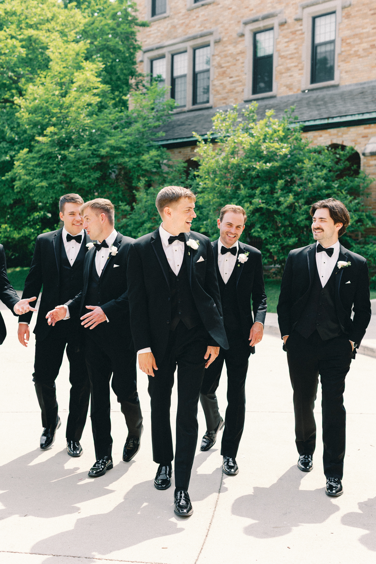groom and guys walking