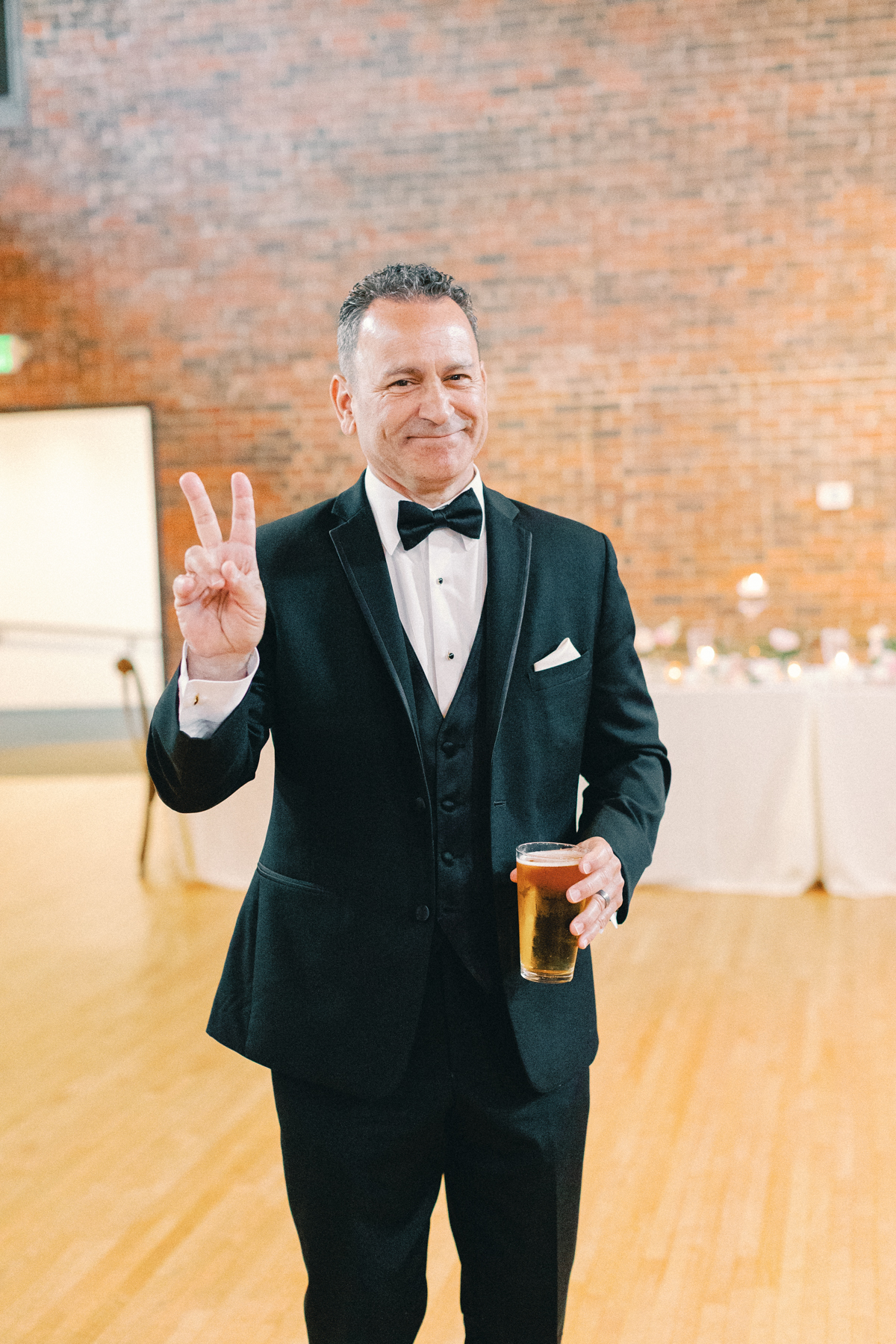 father of the bride smiling