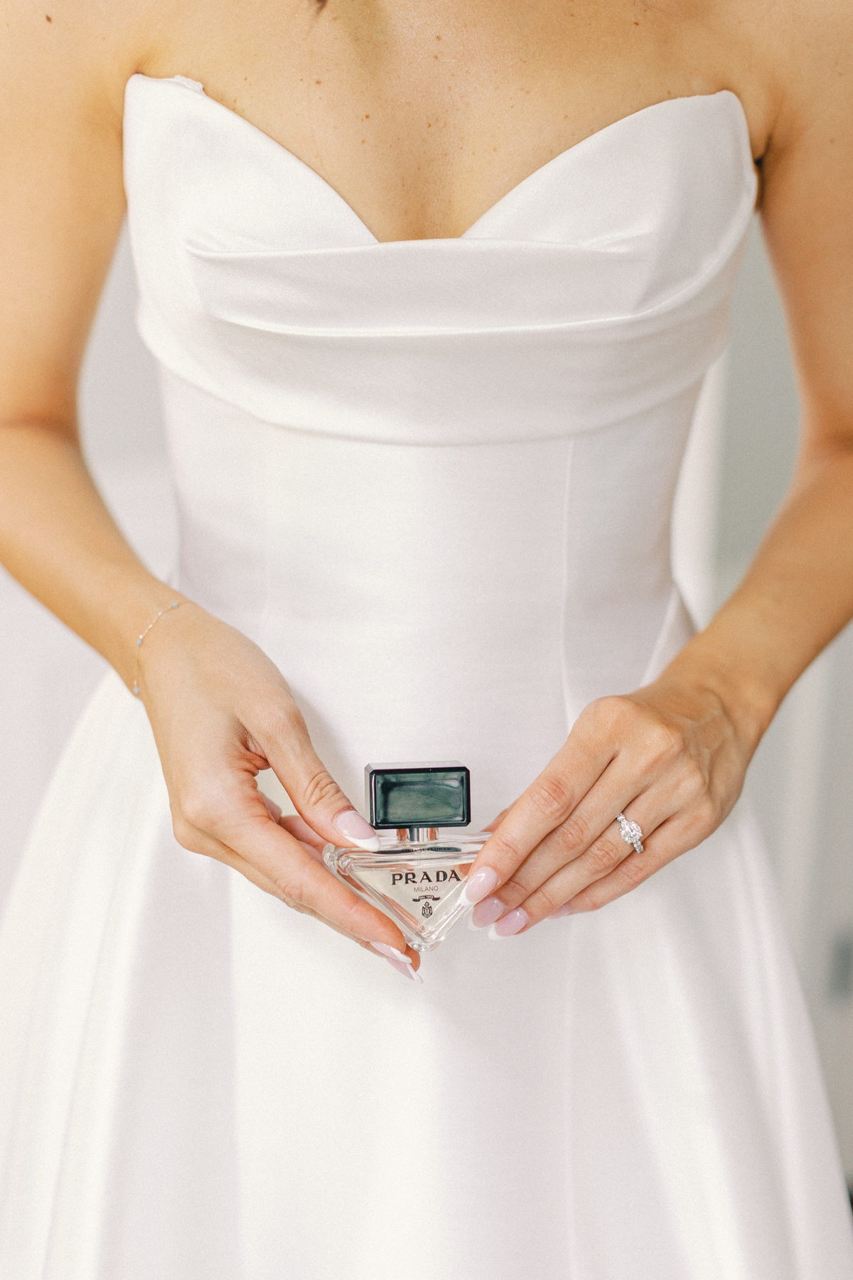 bride holding perfume