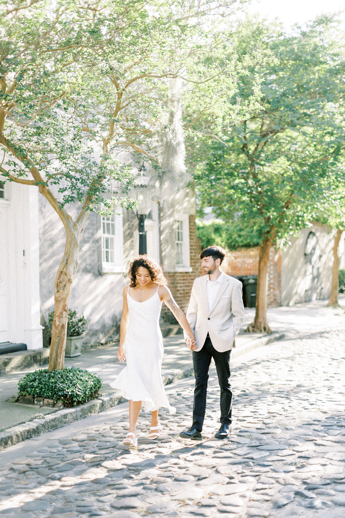 couple walking charleston street